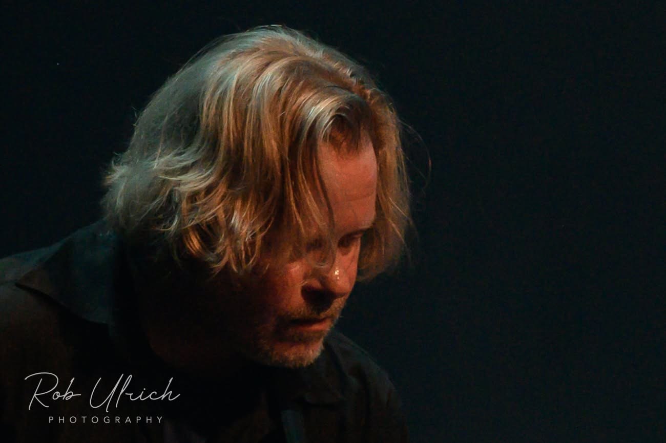 Joop Wolters on stage, lit from the side